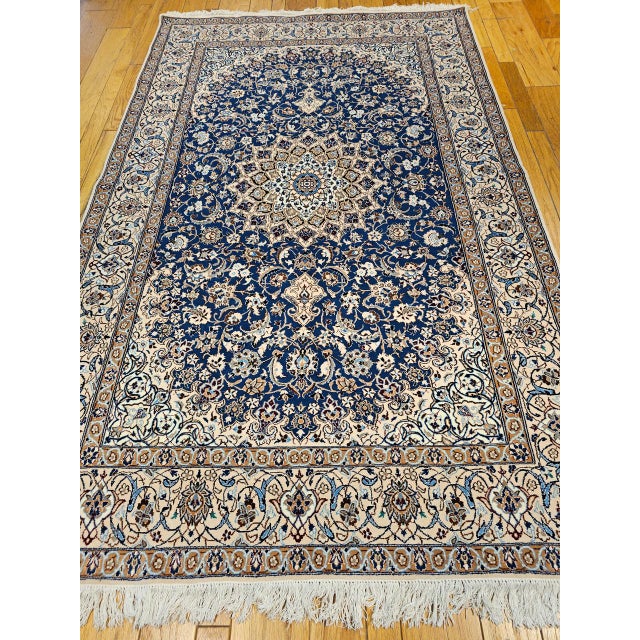 "This exceptional Persian Nain rug, handwoven in the third quarter of the 20th century, showcases a rare and beautiful...