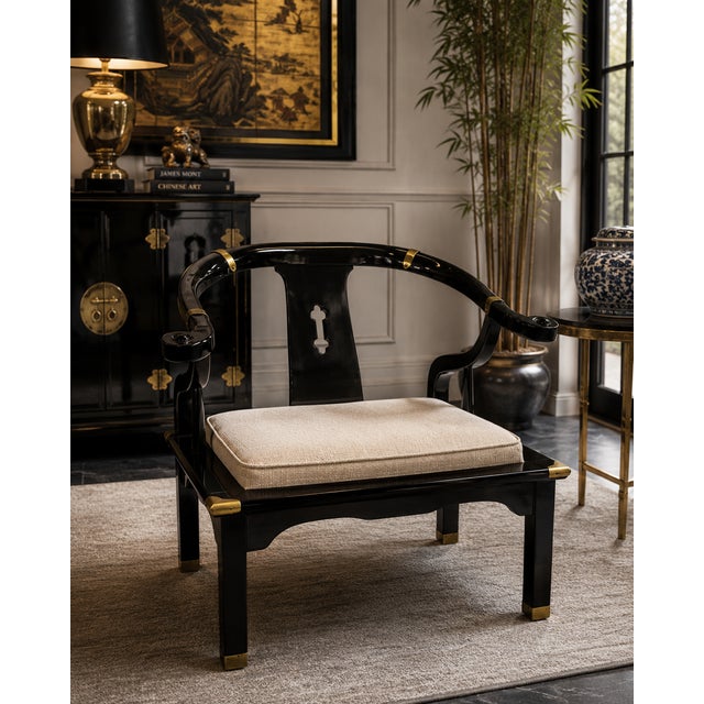 Striking vintage Spanish Chinoiserie armchair in the style of James Mont, featuring a sculptural horseshoe back, sweeping...