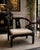 Striking vintage Spanish Chinoiserie armchair in the style of James Mont, featuring a sculptural horseshoe back, sweeping...