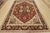A traditional Heriz Ziegler rug, hand-knotted with fine wool and natural dyes. This area rug features a central geometric...