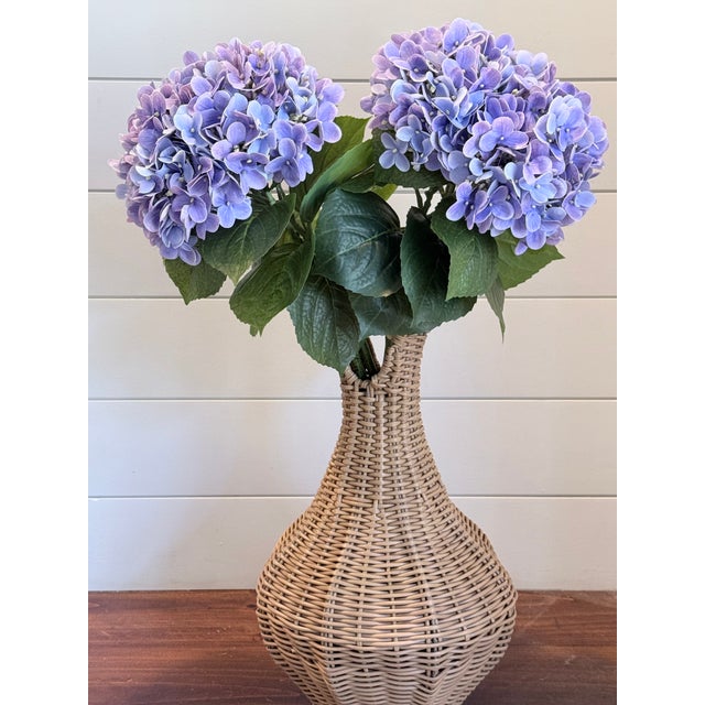 Bring effortless elegance into any space with this handcrafted arrangement featuring lush lavender hydrangeas artfully...