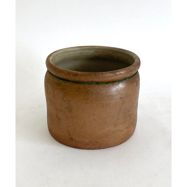 French stoneware pot in the traditional brown clay from the Normandy region. With a single braided handle, this was a...