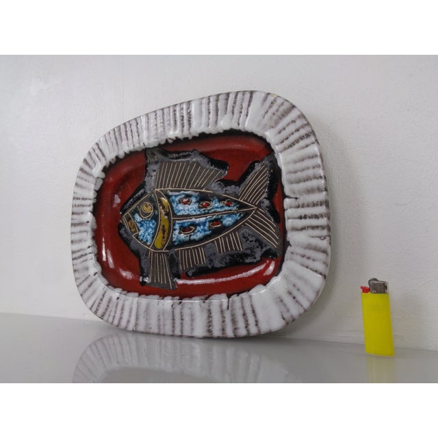 Glazed, lava ceramic bowl or wall hanging with a fish motif by Scheurich from the 1960s. Inscribed on the underside. This...