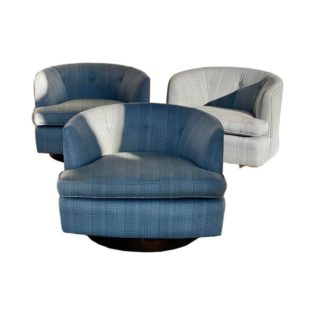 Midcentury modern Milo Baughman style barrel swivel chairs with wooden base. Chairs have beautiful light blue geometric...