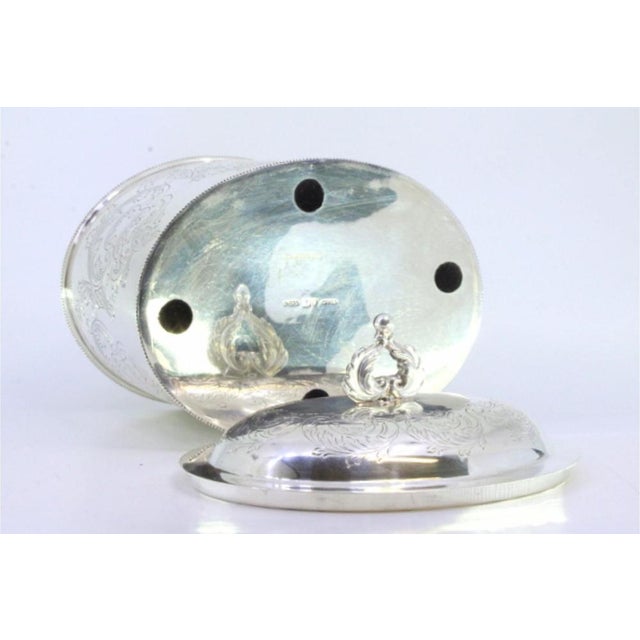 Silver Tea Box with Engraved Plant Motifs, Pearly Friezes Edge and Cut-Out Handle Lid, in Very Good conditions. Designed...