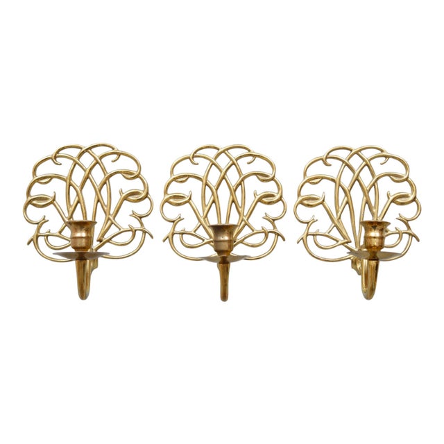 A set of three scrolled brass wall sconces made by Virginia Metalcrafters for their 2001 Williamsburg collection. Simple...