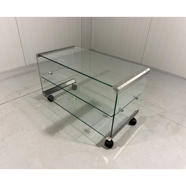 Side table, audio rack, television table on wheels from the Tris series by Gallotti&Radice, Italy (marked). Glass with...