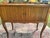 A charming French Provincial nightstand or side table in the Louis XV revival style, crafted in solid oak with a warm...