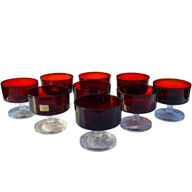 Set of nine ornate vintage French crystal glasses in ruby-red with clear stems. Marked on undersides. This beautiful...