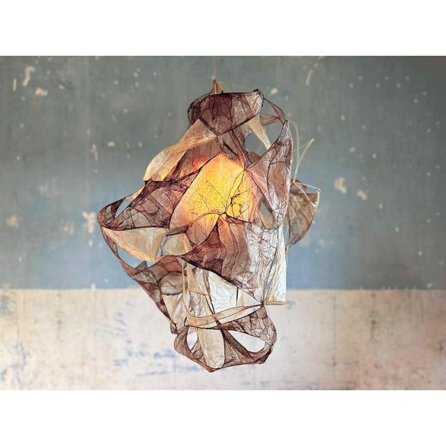 Multi purple pendant lamp in bio material with natural dyes by thibault philip. One of a kind. Dimensions: w 85 x d 68 x h...