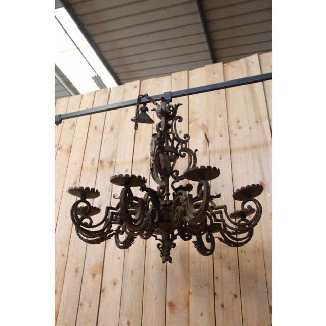 Wrought iron chandelier from the late 18th/early 19th century in good condition coat of arms on the chandelier's stem a...