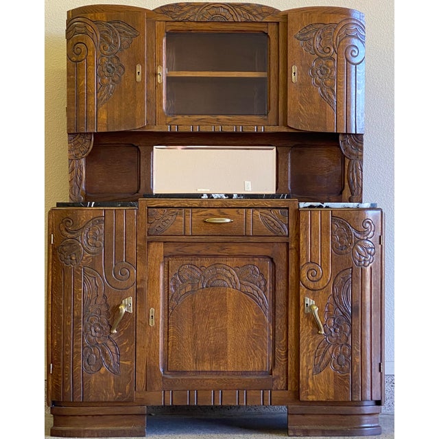 Spectacular 1920's-1930's French Deco Hutch. This vintage beauty has functioning storage galore behind every door. She...