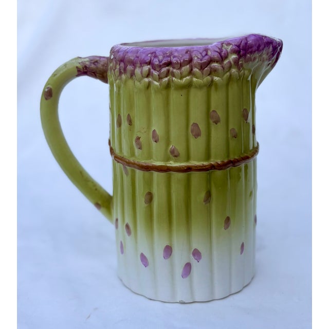 This is a vintage Albert Kessler & Co. ceramic pitcher shaped like a bunch of asparagus. Hand painted with green and...