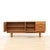 This vintage mid-century extending dining table was produced by Jentique in the 1960s. Made of teak, this extending dining...
