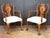 A fine pair of English walnut armchairs in the Queen Anne style - each chair featuring a burl walnut vase-shaped splat and...