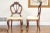 A pair of vintage upholstered hall chairs with carved scrolled form front legs, saber form back legs, nicely upholstered...
