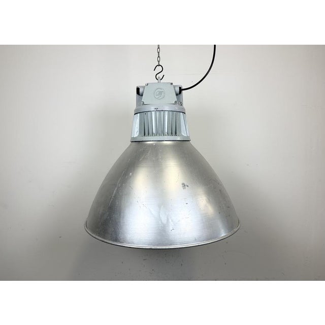 This pendant lamp was made by Elektrosvit and originally used in a factories in former Czechoslovakia in the 1960s. The...
