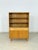 For sale is a beautiful highboard/display cabinet from the 1960s. Its warm elm veneer and particularly expressive, vibrant...