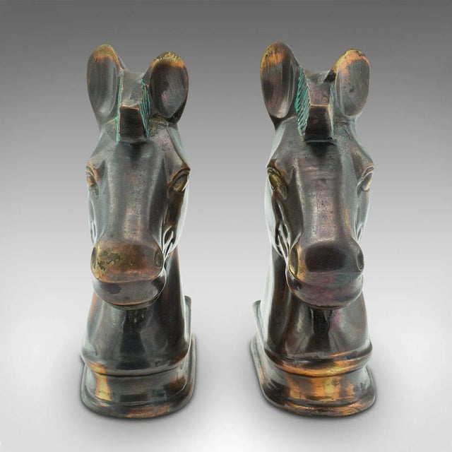 This is a pair of vintage horse bust bookends. An English, cast brass decorative novel rest, dating to the late 20th...