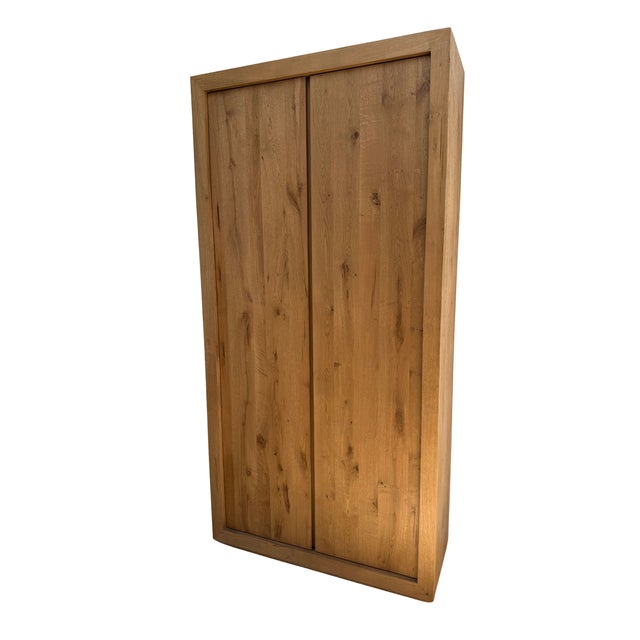 Restoration Hardware's signature understated elegance, this rustic oak double-door cabinet blends seamlessly into both...
