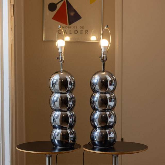 Sculptural pair of 1970s chrome stacked ball table lamps attributed to George Kovacs, executed in the iconic “caterpillar”...