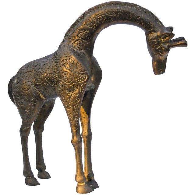 Vintage solid brass giraffe featuring ornate details and natural patina. No maker's mark. This beautiful accent ships...