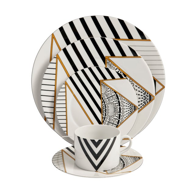 Crafted from fine porcelain, this set of four Alina Dinner Plates is defined by bold graphic lines, layered geometric...