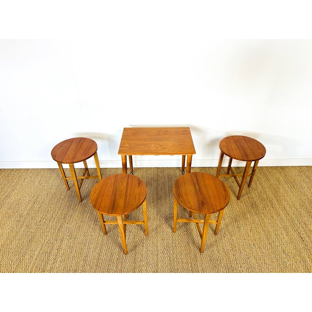 An elegant set of vintage nesting coffee tables from the 1960s, featuring a design that is both functional and refined....