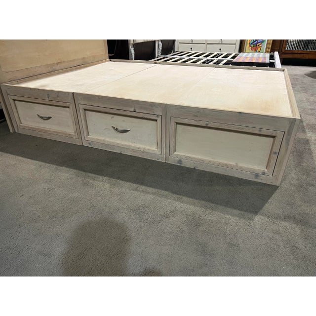 Bring both warmth and functionality to your bedroom with this beautifully crafted natural wood queen-size bed frame....