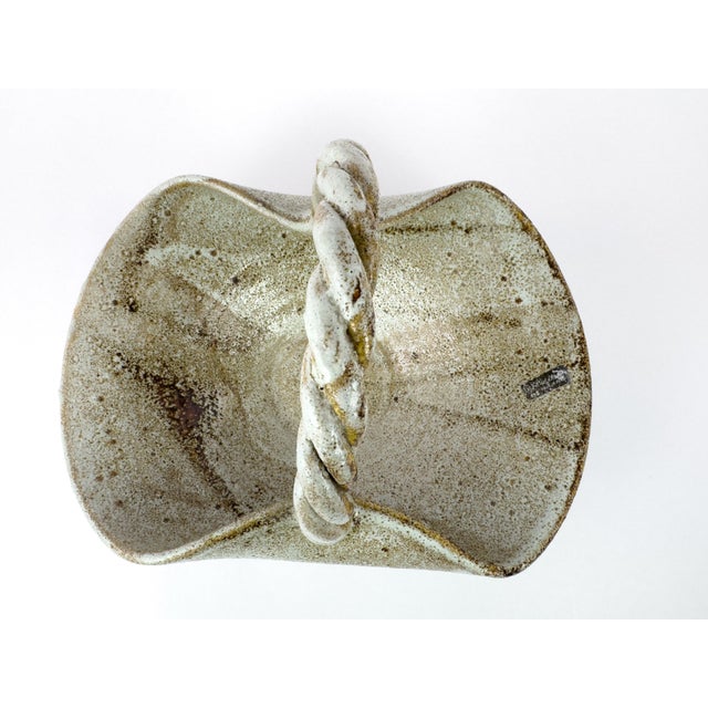 Large vintage stoneware basket by Les Potiers d’Accolay, France, circa 1960s. This sculptural basket is defined by its...