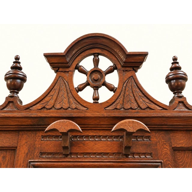 A magnificent solid oak entryway coat rack, an elegant testament to the napoleon iii style of the last quarter of the 19th...