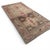 This antique Karabagh runner, approximately 110 years old, presents a striking yet nuanced composition centered around...