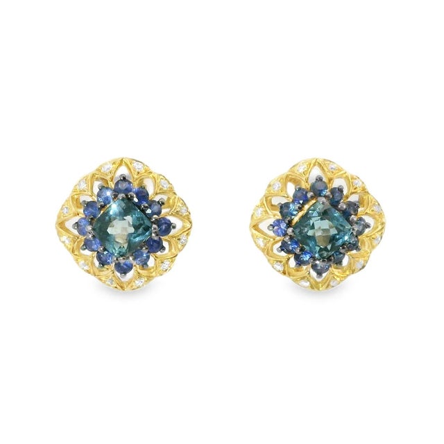 Fascinating 14K Yellow Gold Blue Topaz Sapphire Diamond Stud Earrings. Metal: 14K Yellow Gold Gemstones: Princess Shaped...
