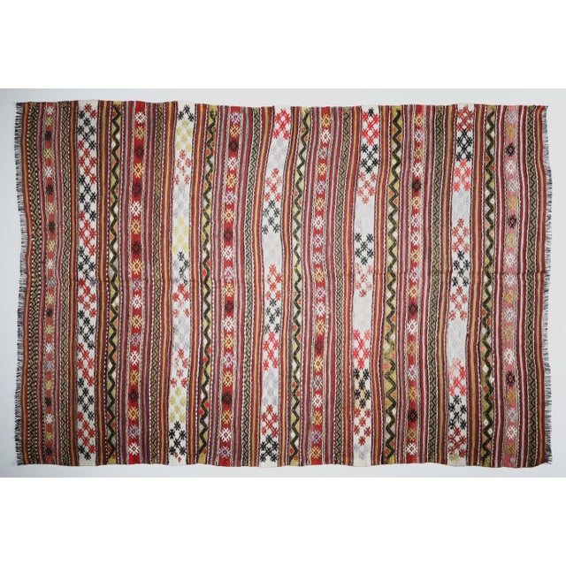 Vintage Tribal Flatweave Kilim with Striped Bands and Anatolian Motifs – Handwoven Wool Textile This vibrant tribal...