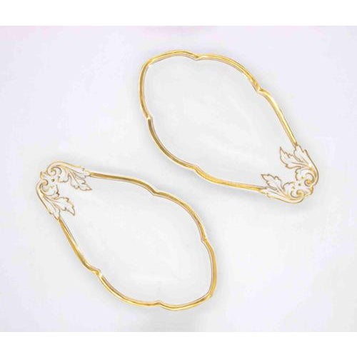 Pair of saucière realized by Richard Ginori manufacture, in Italy, in the mid-20th Century. Made of white glazed...