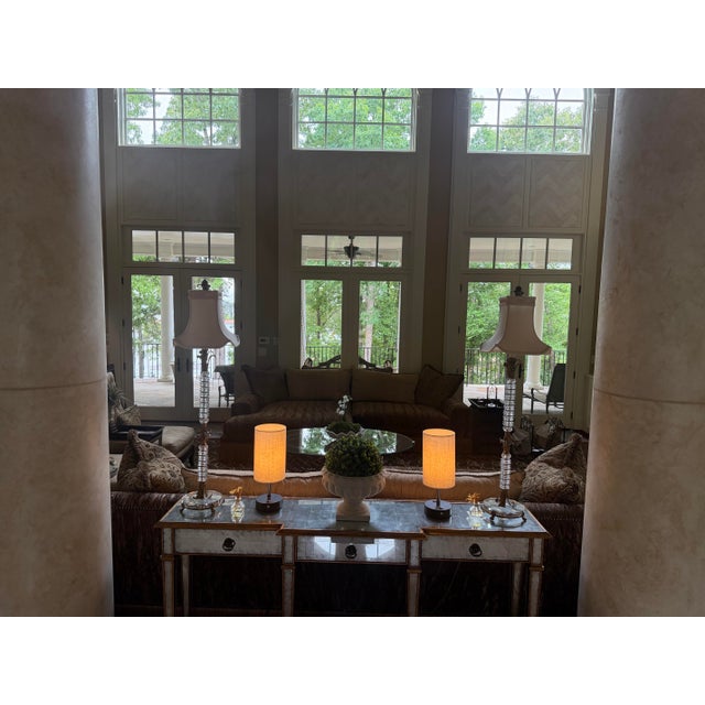 Two beautiful Marge Carson 118”W x 54”D x 34” H brown with hint of gold’ sofa’s with decorative trim and antique brass...
