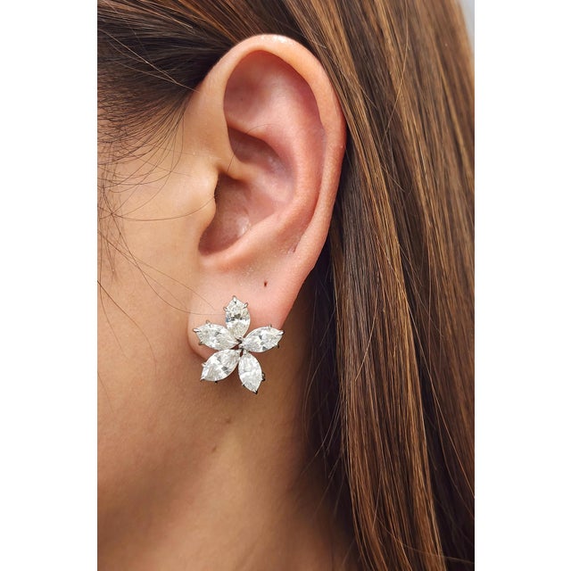 These exquisite diamond stud earrings are a captivating addition to any fine jewelry collection. Showcasing striking 10...