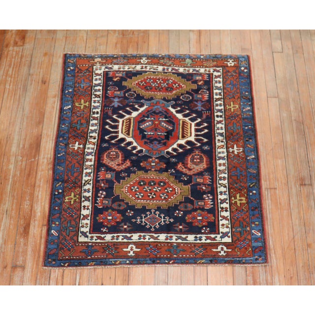 An early 20th century traditional navy blue and brown square size Persian Heriz carpet. Measures: 3'4" x 4' Heriz carpets...