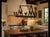 Striking vintage 8-light wrought iron chandelier featuring whimsical rooster motifs and an ingenious design with six...