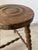 Antique tripod stool in solid wood The turned wooden legs give the stool its authenticity and charm. The patinated wood...