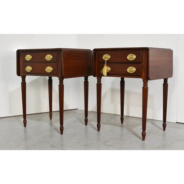 Enhance your living space with the timeless charm of our Mid Century Sheraton Style Fluted Leg Flip Top Tables....