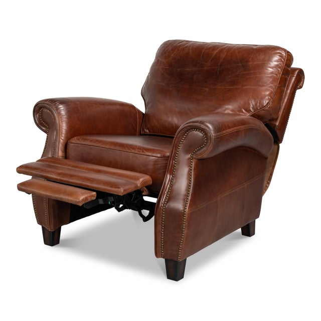 Rolled arms, nailhead trim, and deep chestnut leather conceal a full reclining mechanism within a traditional club-chair...