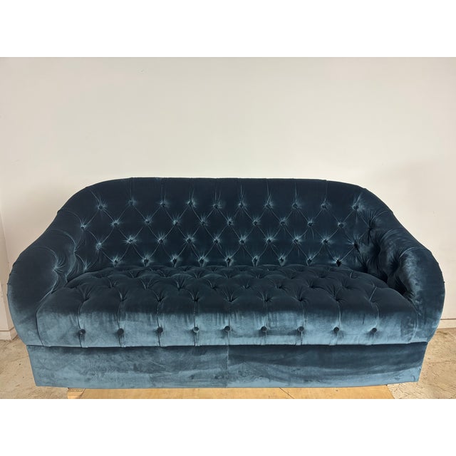 Curved tufted loveseat by Ward Bennett for Brickel Associates. This loveseat is newly upholstered in a beautiful indigo...