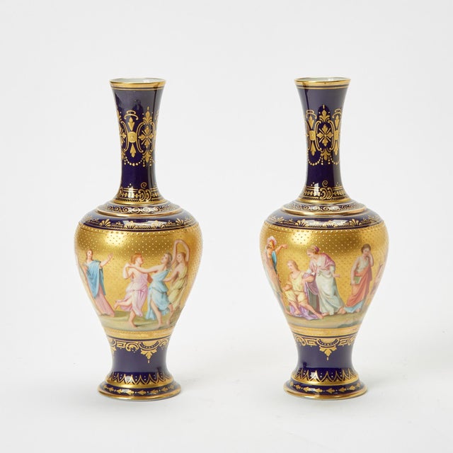 An elegant pair of antique Austrian porcelain decorative vases, made in Austria during the early 20th century, circa 1915....