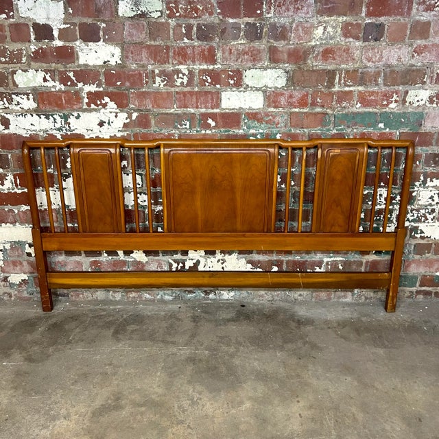 King size head board designed by John Widdicomb. This piece has intricate curved and rounded edges making for a playful...