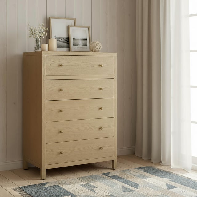 Elevate your space with the timeless charm and functional elegance of the Butler Specialty Company Nora 5 Drawer Tall...