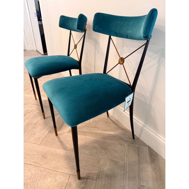 These beautiful dining chairs by Jonathan Adler have modern style with neoclassical elegance. Each chair features polished...