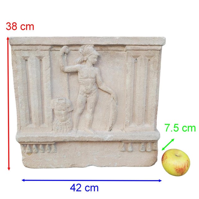 A bas-relief carved stone depicting a heroic warrior or deity (probably Mars or Heracles) represented in the pure...