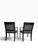 Beautiful pair of classic accent chairs featuring black wood frames, ornate gold detailing, and elegant black-and-gold...
