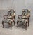 A charming set of two Queen Anne style armchairs with a matching ottoman all custom upholstered in the past decade in...